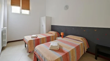 Room with two separate beds