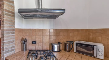 Kitchen with stove and microwave
