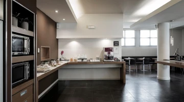 Breakfast room with buffet counter, microwave and refrigerator