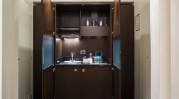 Studio de luxe avec cuisine cachée