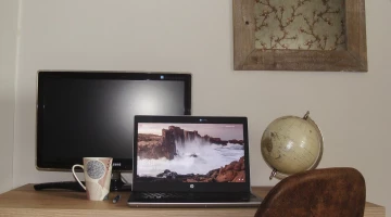 Room with desk and TV