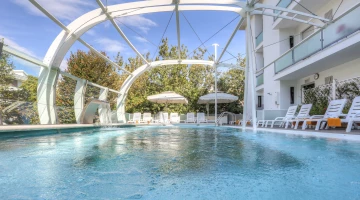 The swimming pool, a large aquarium suspended in the void
