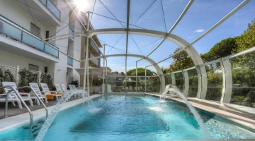 The swimming pool, a large aquarium suspended in the void