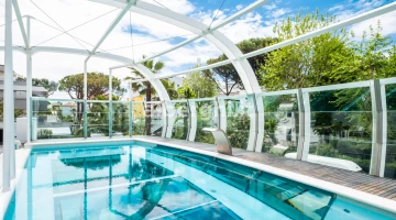 The swimming pool, a large aquarium suspended in the void