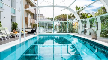 The swimming pool, a large aquarium suspended in the void