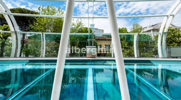 The swimming pool, a large aquarium suspended in the void