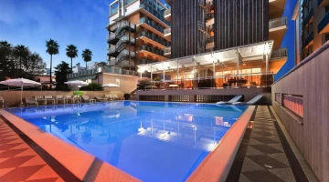 Pool and veranda illuminated in the evening