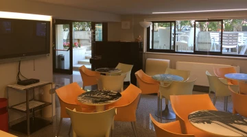 Tables and chairs in the common area