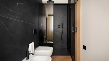 Badezimmer mit Duschkabine im Deluxe-Zimmer