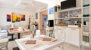 Common area with breakfast buffet corner