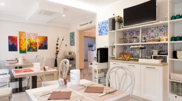 Common area with breakfast buffet corner