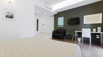 Room with TV and armchair