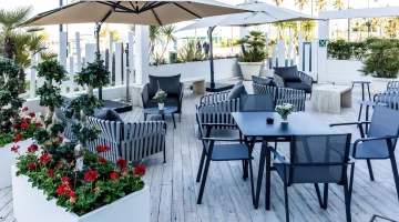 Tables, chairs and sofas outside