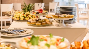 Buffet of side dishes, fruit, desserts