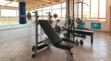 Area fitness con attrezzature technogym