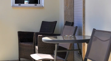 Balcony with table and chairs