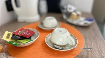 Electric kettle and coffee machine in the room