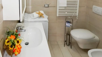 Apartment bathroom with washing machine