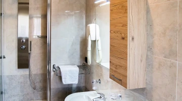 Bathroom with hairdryer and shower cubicle