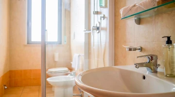 Private bathroom with shower cubicle and courtesy set