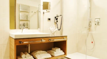 Private bathroom with shower and hairdryer