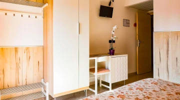 Room with a TV and desk