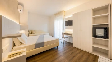 Double room with sofa and private balcony