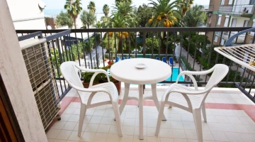 Room with furnished balcony