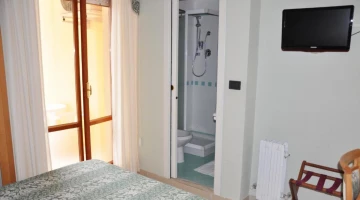 Room with bathroom and TV