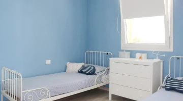 Doppelzimmer mit Einzelbetten im Apartment