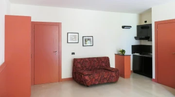 Living room with kitchenette in apartment