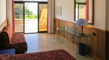 Room with private furnished balcony