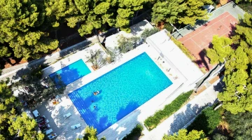 Aerial view of the garden with swimming pools and sports field