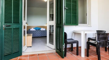 Private balcony with table and chairs
