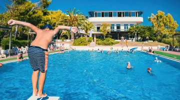 Swimming pool with diving board