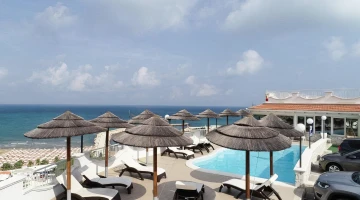 Pool area with sunbeds and umbrellas