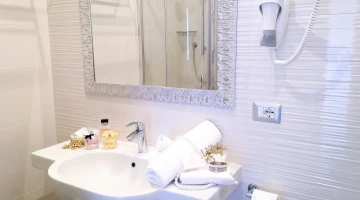 Bathroom with hairdryer and towel set