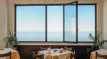 Restaurant room with windows overlooking the sea