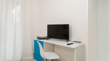 TV and desk in the room