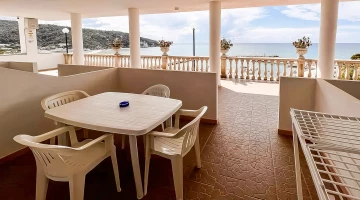 Terrace with table and clothesline