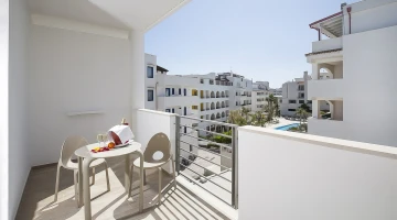 Furnished balcony with pool view