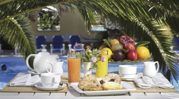 Breakfast on the veranda overlooking the pool