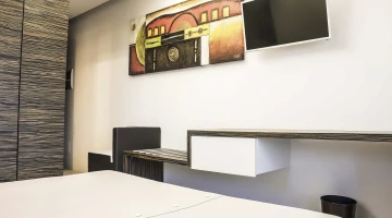 Room with a TV and desk