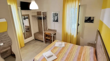 Room with open wardrobe