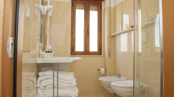 Bathroom with shower cubicle and hairdryer