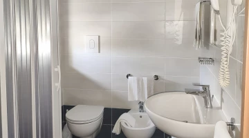 Private facilities with shower box and wall-mounted hairdryer