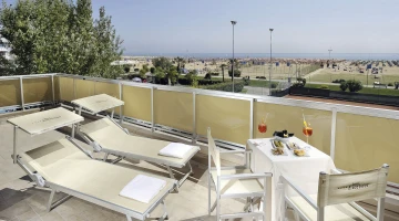 Private sea view balcony with sun loungers