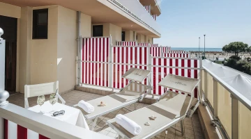 Side sea view balcony with sun loungers