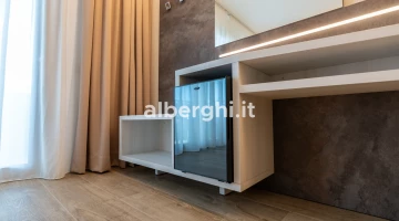 Minibar and luggage rack in the room