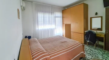 Room with wardrobe and desk